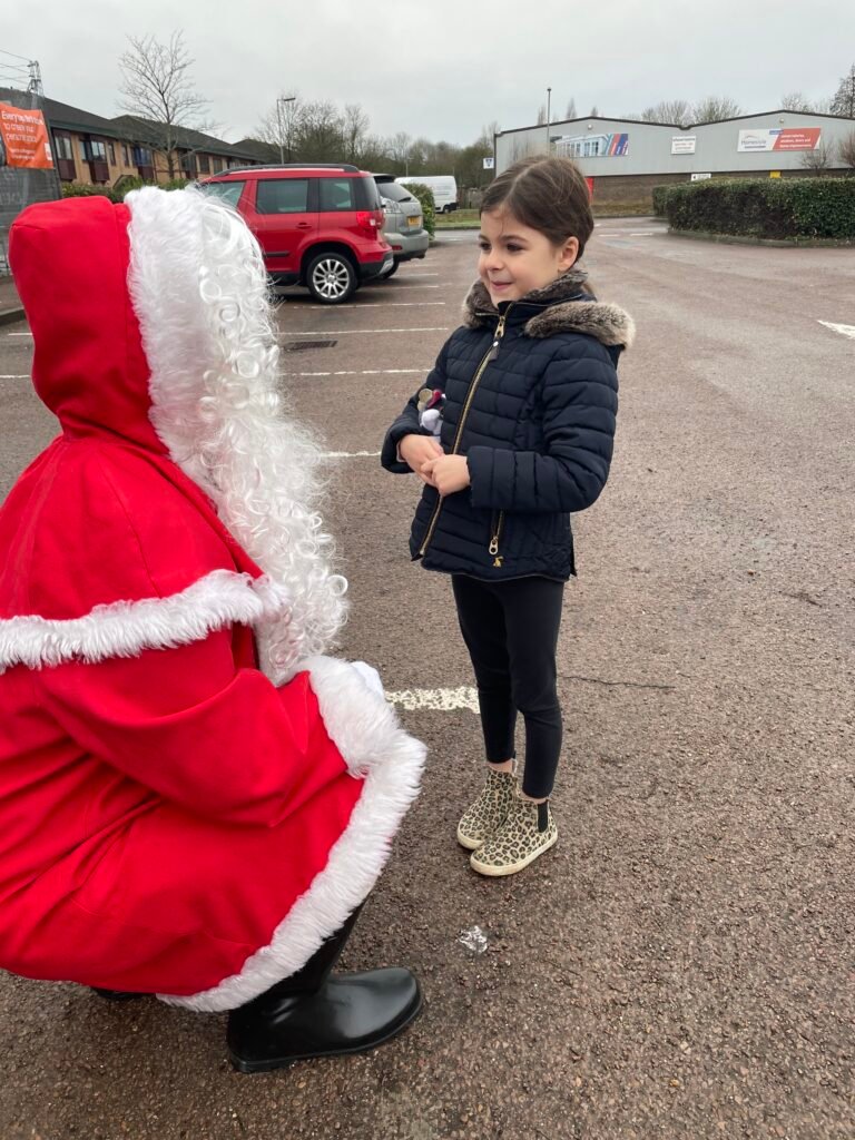 Santa chatting to a very sweet youngster