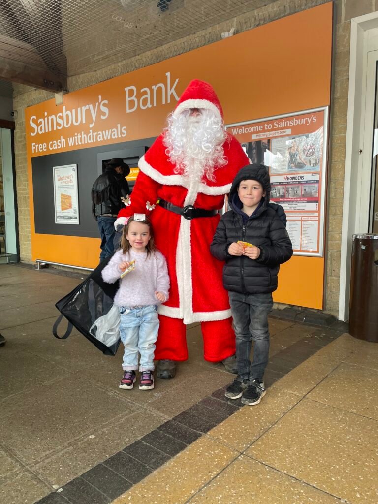 Santa and youngsters pose for picture