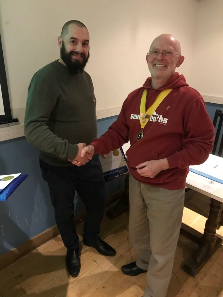 Lion Wyn congratulates new member, Dan